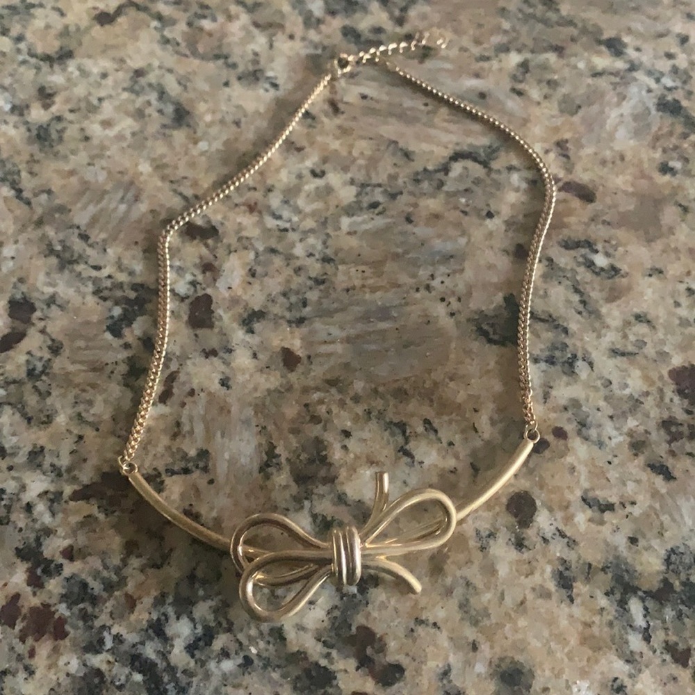 C. wonder gold bow necklace